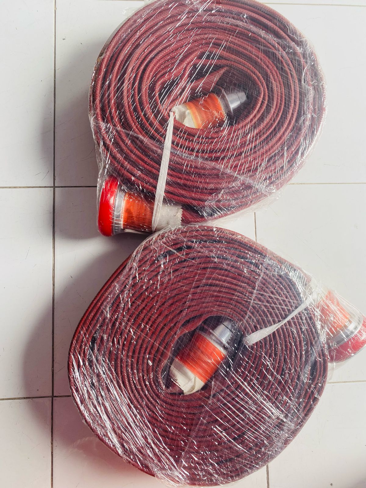 FIREHOUSE RED RUBBER MACHINO CPLG 2.5 INCH 20 METER